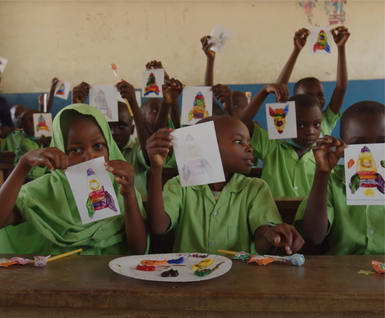 Kenyan children using the desks and school that was recently built